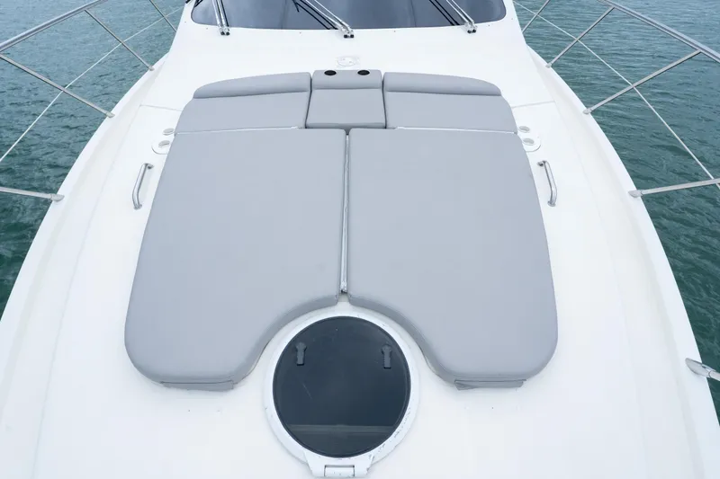 Slide: The Image of 2008 Azimut 62E yacht with gray sunbathing cushions on deck. - 13