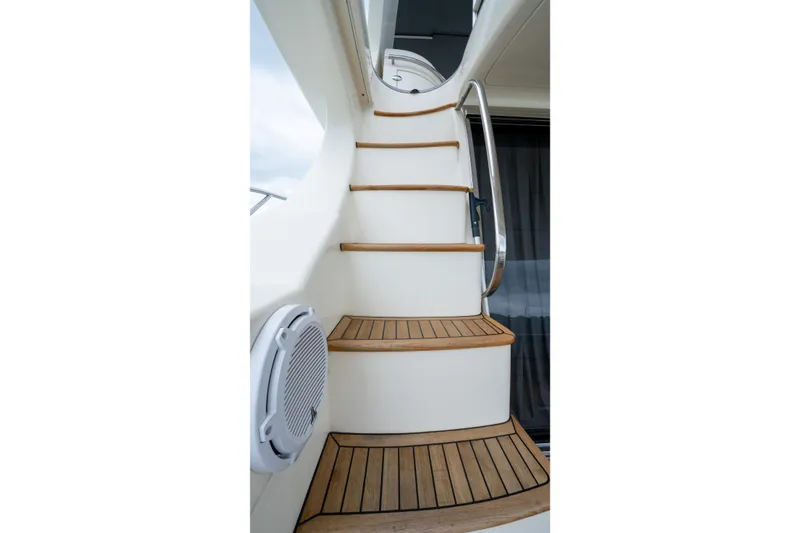 Slide: The Image of Staircase on 2008 Azimut 62E yacht with wooden steps and metal railing. - 18