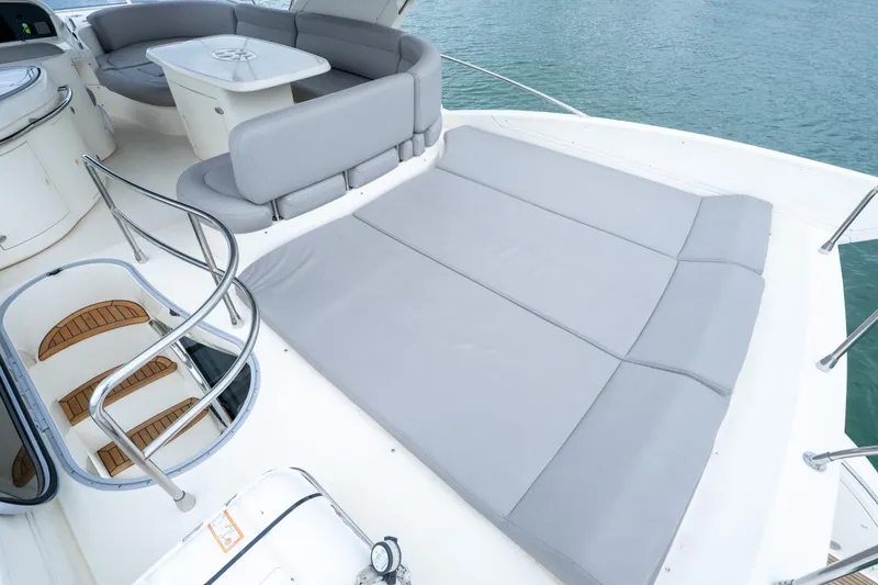 Slide: The Image of Luxurious 2008 Azimut 62E yacht deck with seating and sunbathing area. - 20