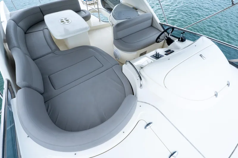 Slide: The Image of Luxurious seating area on a 2008 Azimut 62E yacht, overlooking the ocean. - 23