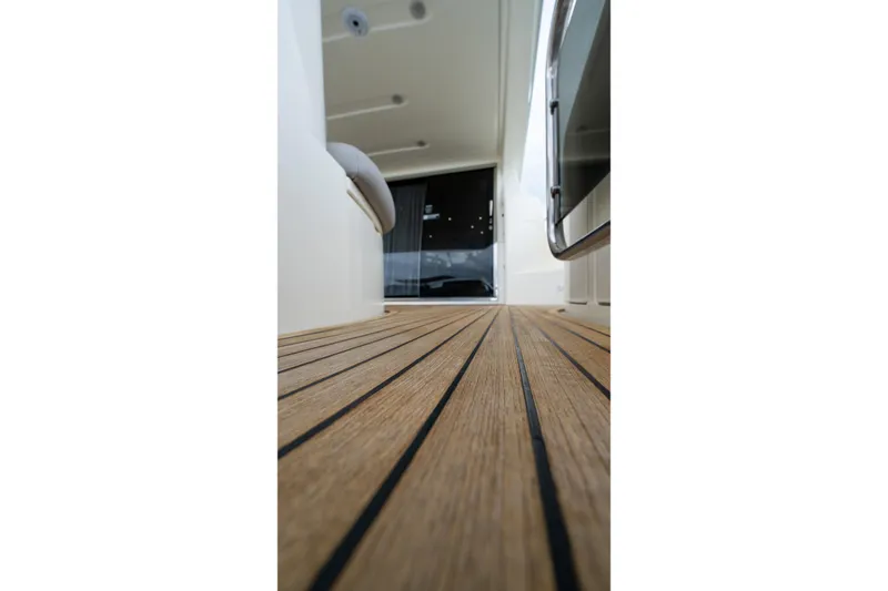Slide: The Image of Teak deck of 2008 Azimut 62E yacht, showcasing sleek design and craftsmanship. - 24