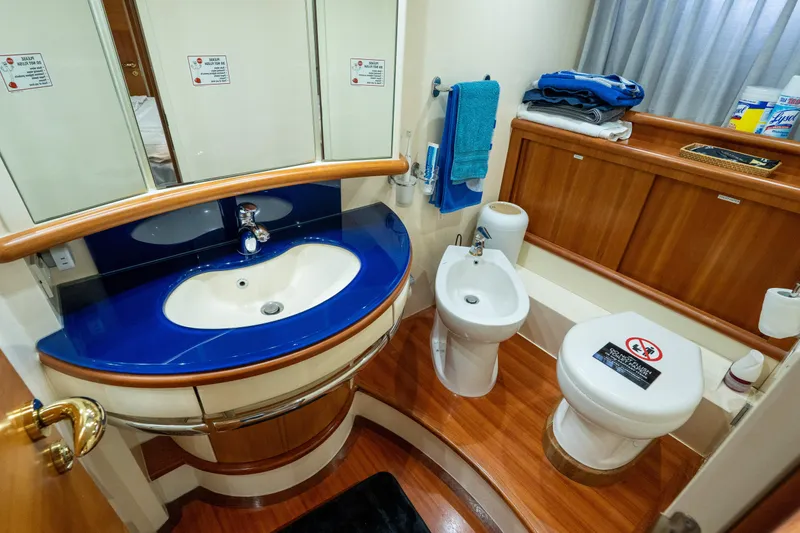 Slide: The Image of Luxurious 2008 Azimut 62E yacht bathroom with modern fixtures and wooden accents. - 25