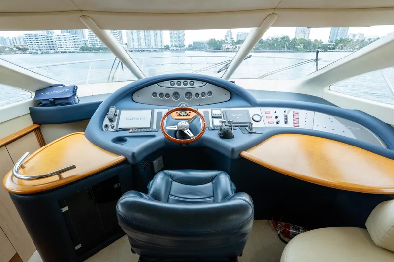 Slide: The Image of Helm of 2008 Azimut 62E yacht with modern navigation equipment and leather seating. - 29