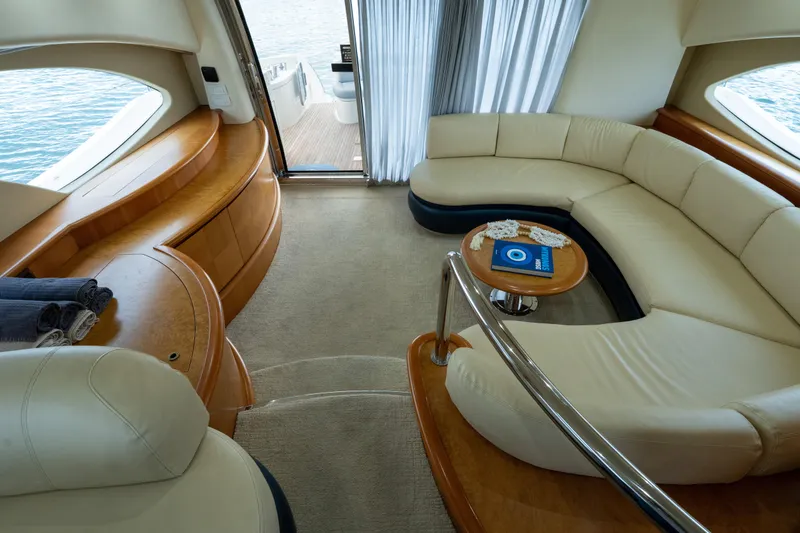 Slide: The Image of Luxurious interior of 2008 Azimut 62E yacht with elegant seating and wooden accents. - 31