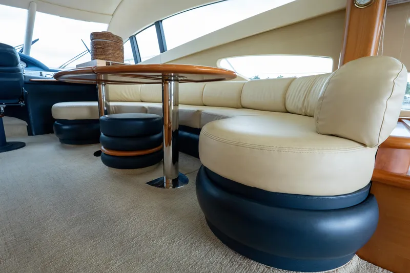 Slide: The Image of Luxurious interior of a 2008 Azimut 62E yacht with elegant seating and table. - 34