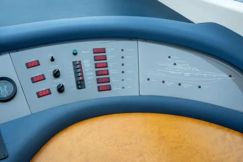 Slide: The Image of Control panel of a 2008 Azimut 62E yacht with digital displays and switches. - 37