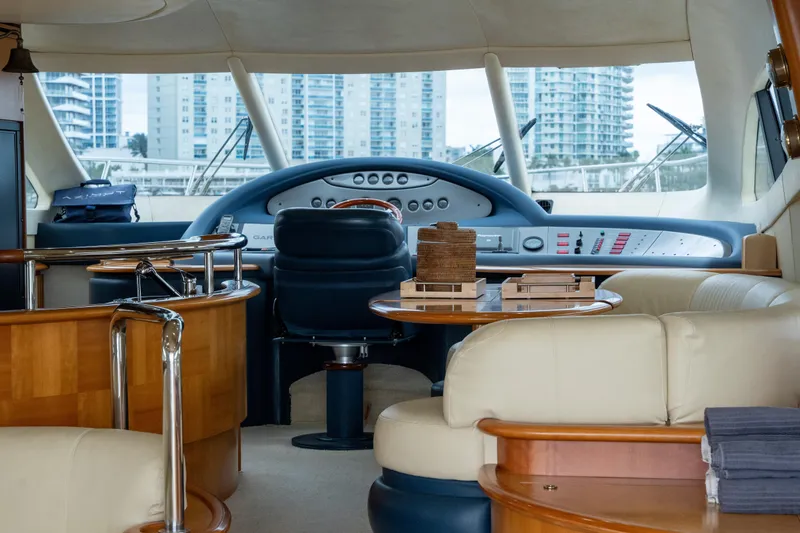 Slide: The Image of Luxurious interior of a 2008 Azimut 62E yacht with modern furnishings and cityscape view. - 38