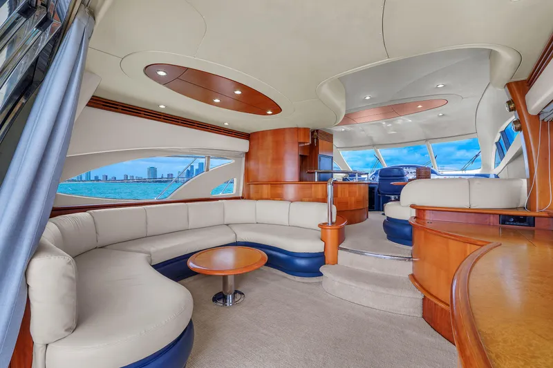 Slide: The Image of Luxurious interior of a 2008 Azimut 62E yacht with elegant seating and panoramic windows. - 40