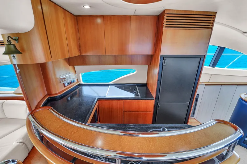 Slide: The Image of Luxurious kitchen interior of 2008 Azimut 62E yacht with wood cabinetry and ocean view. - 41