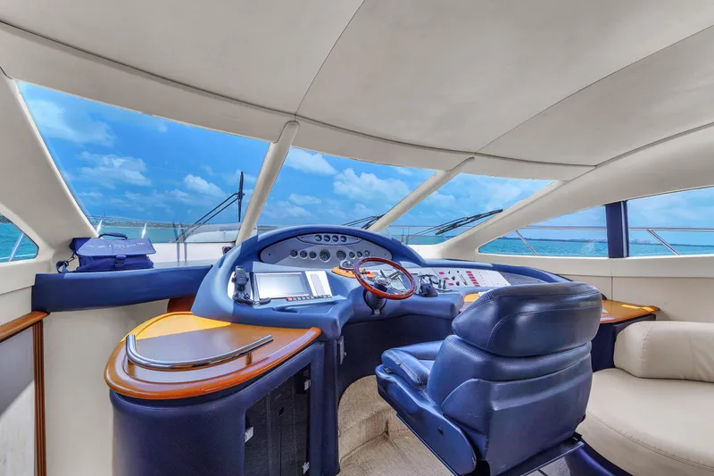 Slide: The Image of Helm of 2008 Azimut 62E yacht with ocean view and modern controls. - 43