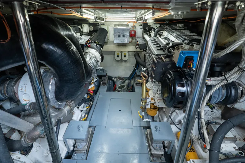 Slide: The Image of Engine room of a 2008 Azimut 62E yacht, showcasing mechanical components and systems. - 45