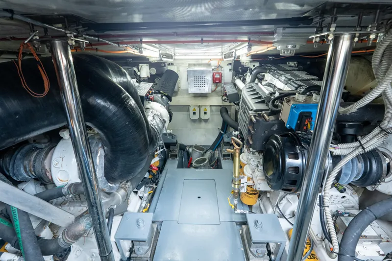 Slide: The Image of Engine room of a 2008 Azimut 62E yacht, showcasing mechanical components and systems. - 46