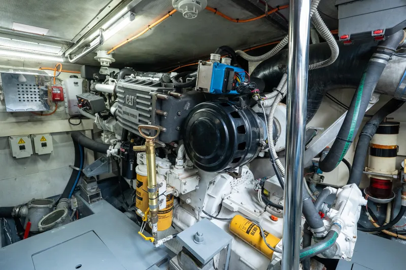 Slide: The Image of Engine room of a 2008 Azimut 62E yacht, featuring a CAT marine engine. - 47