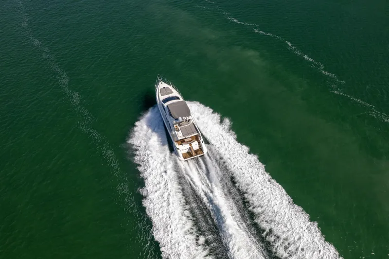 Slide: The Image of Aerial view of 2008 Azimut 62E yacht cruising on open water. - 7