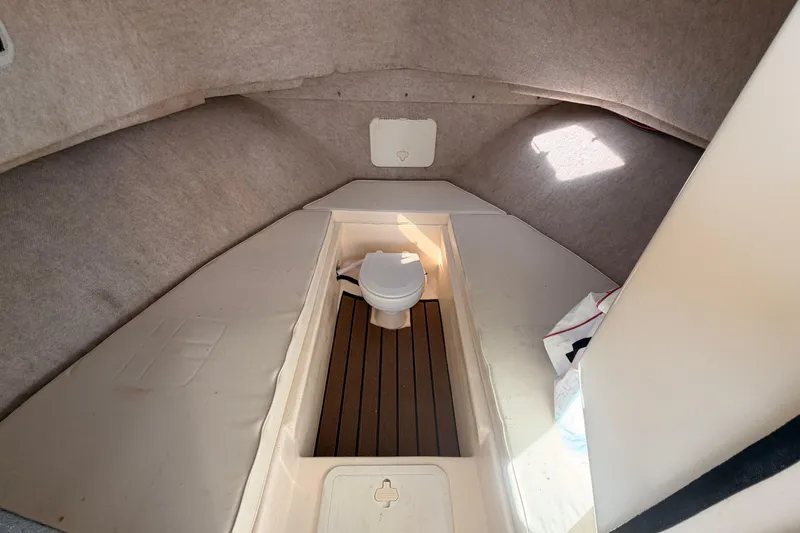 Slide: The Image of Interior cabin of 2004 Parker 2520 XL Sport Cabin boat with toilet and seating. - 20