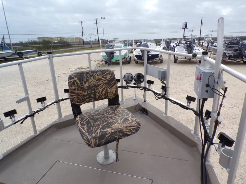 Slide: The Image of 2022 Alweld 1960V boat with camo seat and electronics. - 14