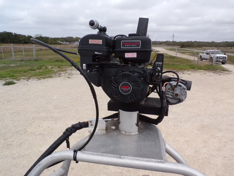 Slide: The Image of Alweld 1960V 2022 boat engine on a trailer outdoors. - 16