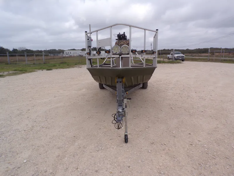 Slide: The Image of 2022 Alweld 1960V boat on trailer, front view on gravel lot. - 7