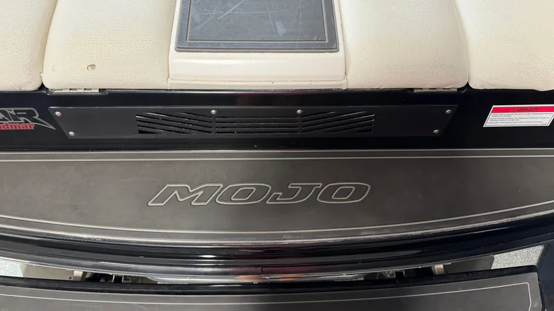 Slide: The Image of Rear view of a 2016 Moomba Mojo with padded seat and logo. - 12