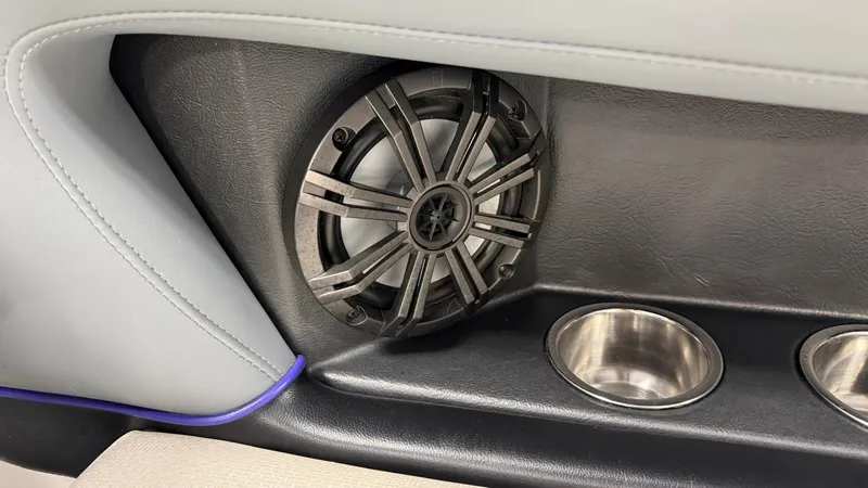 Slide: The Image of Speaker and cup holders in a boat, featuring gray and black interior. - 28