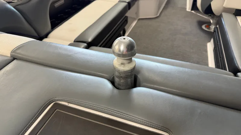 Slide: The Image of Close-up of a gray boat interior with a metal knob. - 20