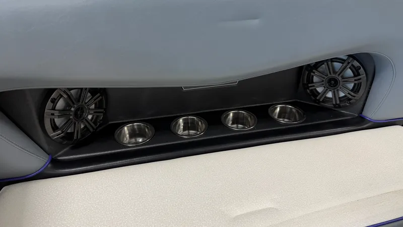 Slide: The Image of Speakers and cup holders in a boat, integrated into gray upholstery. - 27