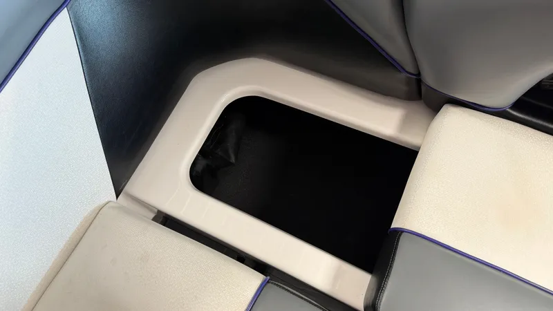 Slide: The Image of An open storage compartment in the seating area of a boat. - 40