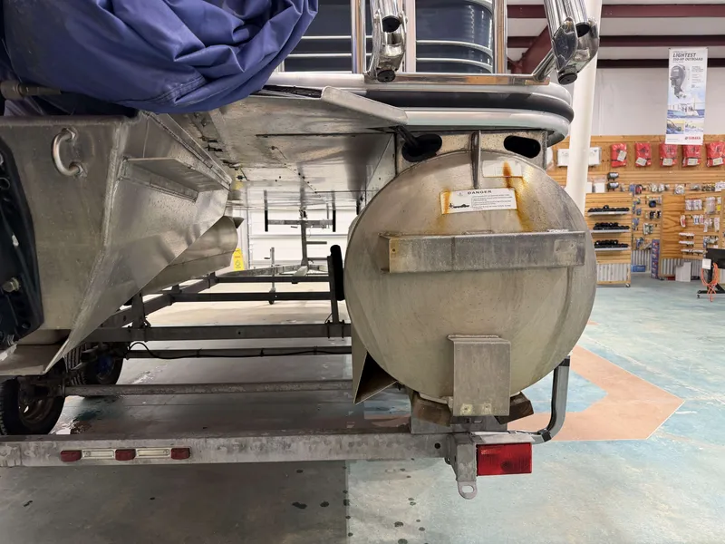 Slide: The Image of Rear view of a 2014 Lowe SS 210 boat on a trailer. - 21