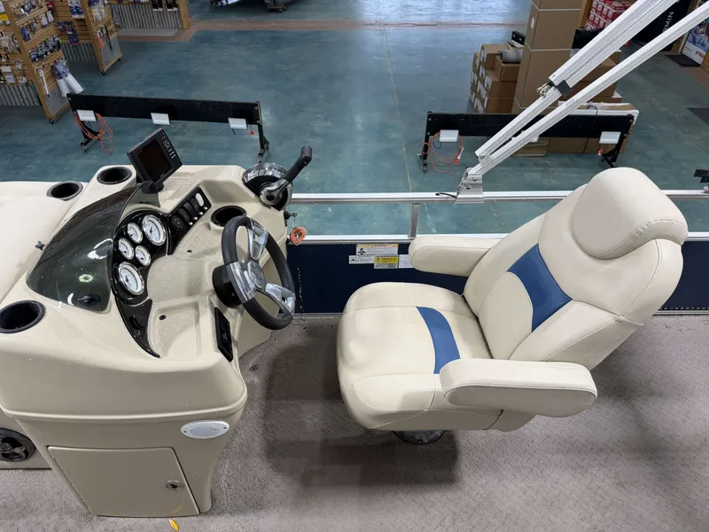 Slide: The Image of Interior of a 2014 Lowe SS 210 boat with helm console and seat. - 8