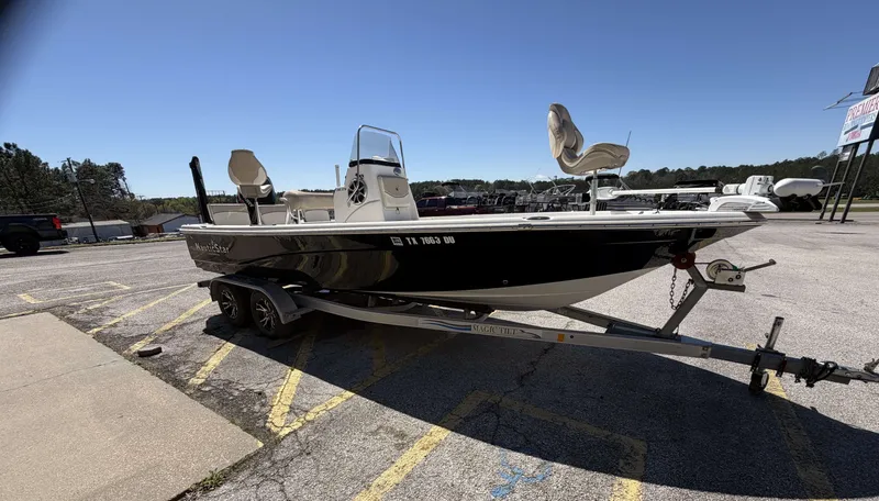 Slide: The Image of 2017 NauticStar 215 XTS boat on trailer outdoors. - 10
