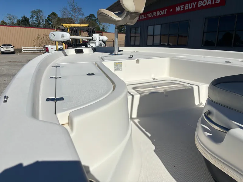 Slide: The Image of 2017 NauticStar 215 XTS boat interior view at a boat dealership. - 14