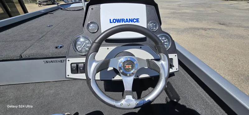 Slide: The Image of Steering wheel of a 2014 Ranger RT188 boat with Lowrance display. - 17