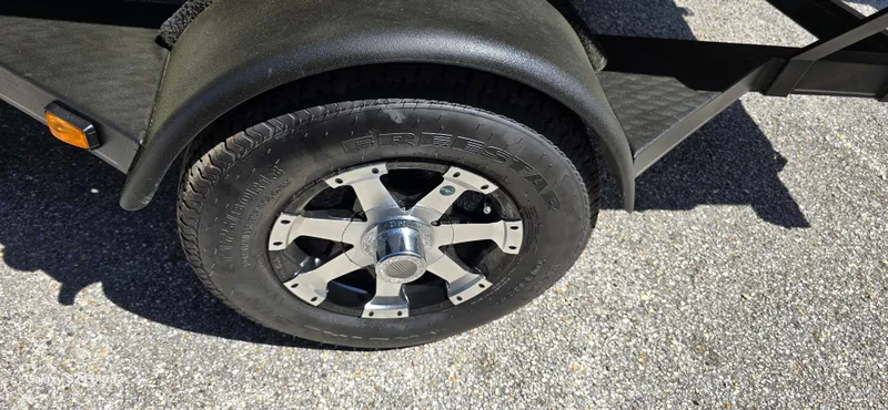 Slide: The Image of Close-up of a 2014 Ranger RT188 trailer tire on asphalt. - 3