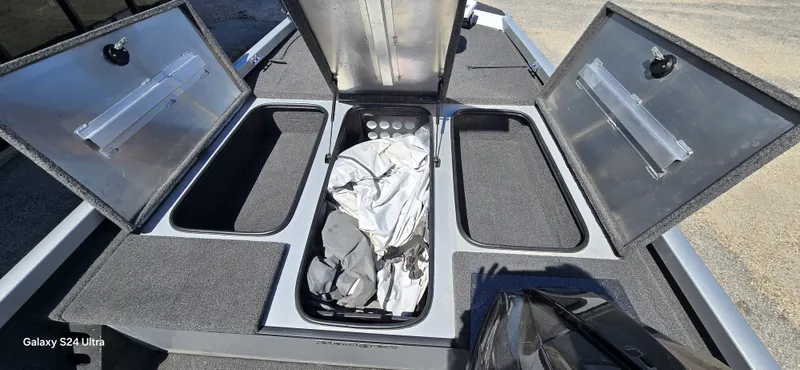 Slide: The Image of Open storage compartments of a 2014 Ranger RT188 boat. - 6