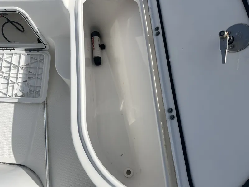Slide: The Image of Interior view of a 2013 Sea Fox 180XT boat with storage compartment. - 14