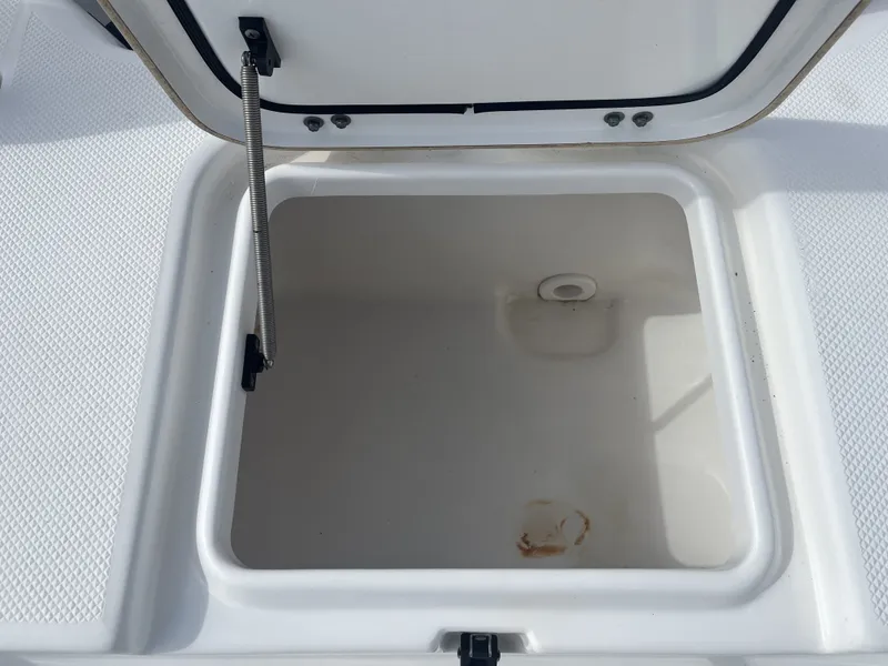 Slide: The Image of Open storage compartment on a 2013 Sea Fox 180XT boat. - 22