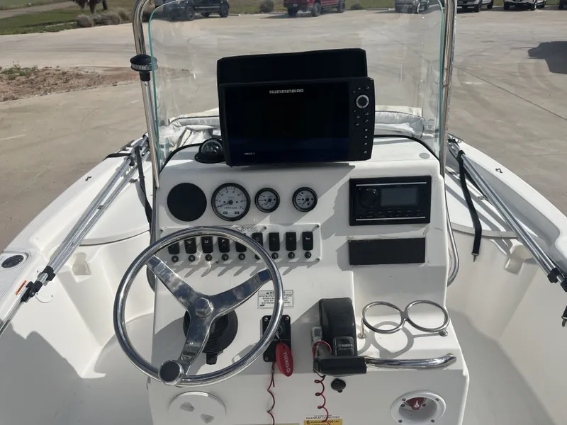 Slide: The Image of Interior view of a 2013 Sea Fox 180XT boat with steering console. - 25