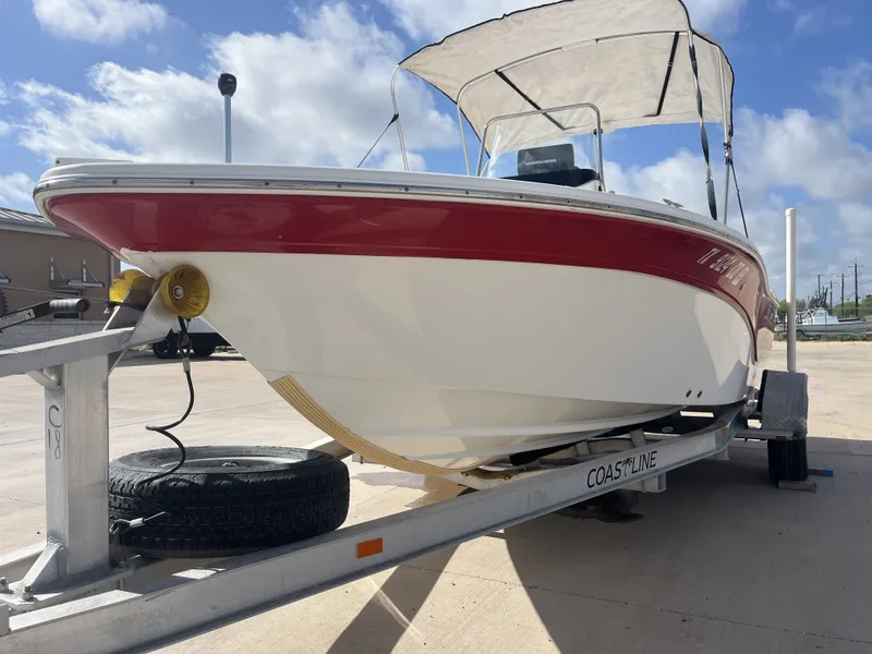 Slide: The Image of 2013 Sea Fox 180XT boat on trailer under sunny skies. - 3