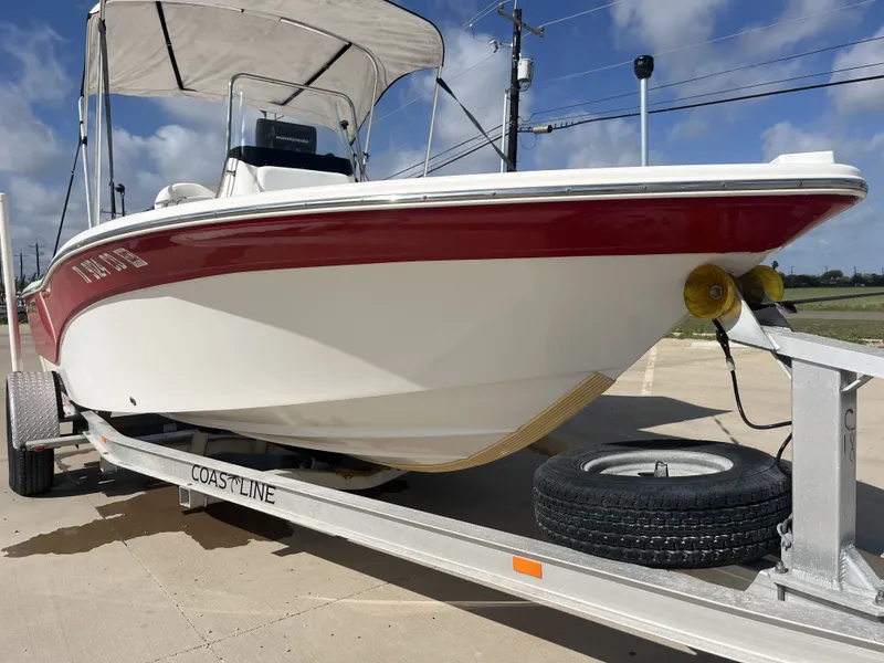 Slide: The Image of 2013 Sea Fox 180XT boat on trailer, red and white design. - 6