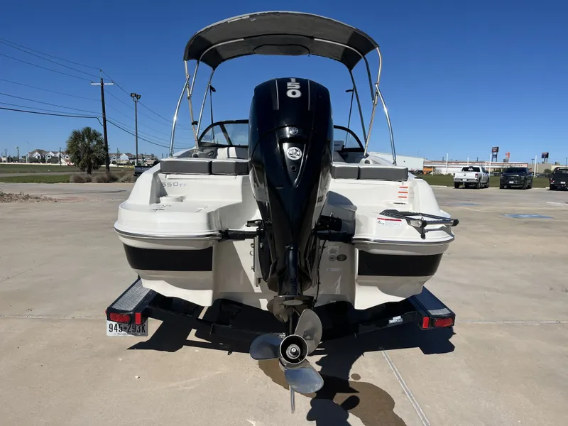 Slide: The Image of Rear view of a 2016 Tahoe 550 TS boat with outboard motor. - 10