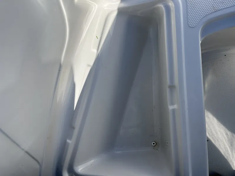 Slide: The Image of Interior of a 2016 Tahoe 550 TS boat, white plastic. - 14