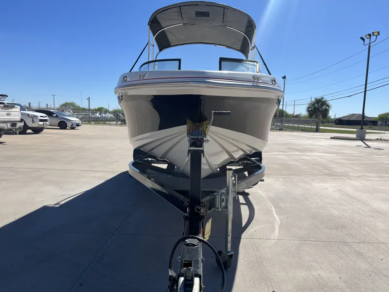 Slide: The Image of 2016 Tahoe 550 TS boat on trailer under sunny skies. - 6