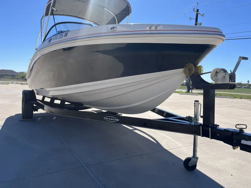 Slide: The Image of 2016 Tahoe 550 TS boat on trailer in sunny weather. - 7