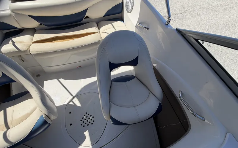 Slide: The Image of Interior of a 2013 TAHOE - WRMG Q5i boat with white seating. - 16