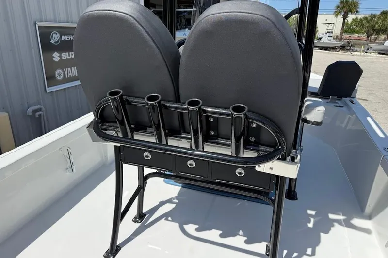 Slide: The Image of 2026 Sea Pro 250 Bay boat seating with rod holders and storage drawers. - 13