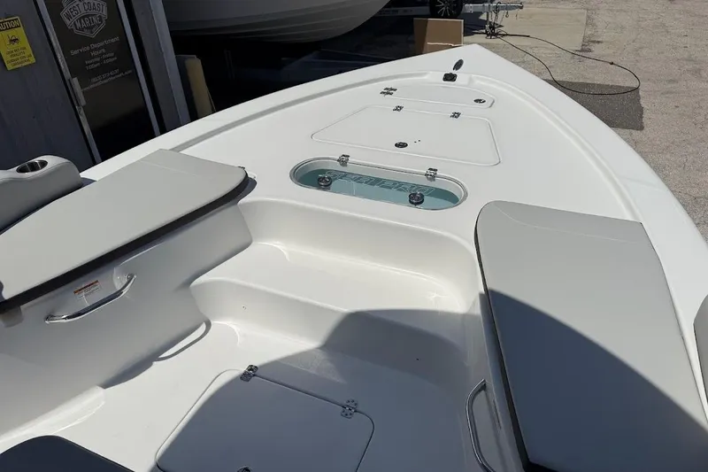 Slide: The Image of 2026 Sea Pro 250 Bay boat interior with seating and storage compartments. - 16