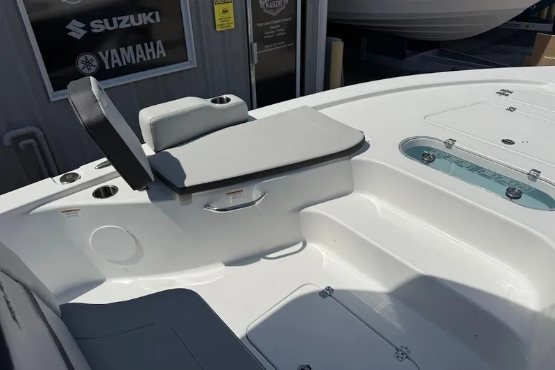Slide: The Image of 2026 Sea Pro 250 Bay boat interior with seating and storage compartments. - 17