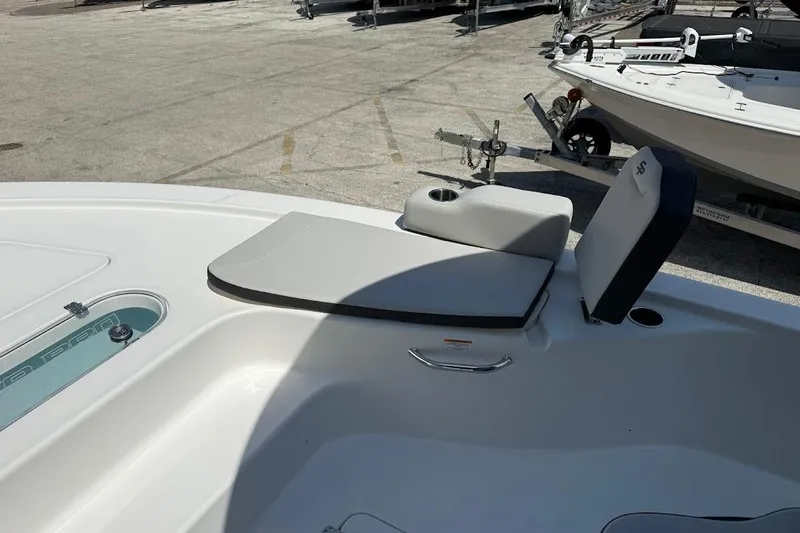 Slide: The Image of 2026 Sea Pro 250 Bay boat interior with seating and storage compartments. - 18