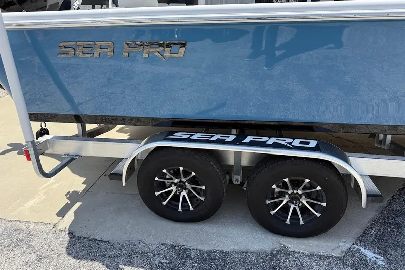 Slide: The Image of 2026 Sea Pro 250 Bay boat on trailer, showcasing sleek design and branding. - 7