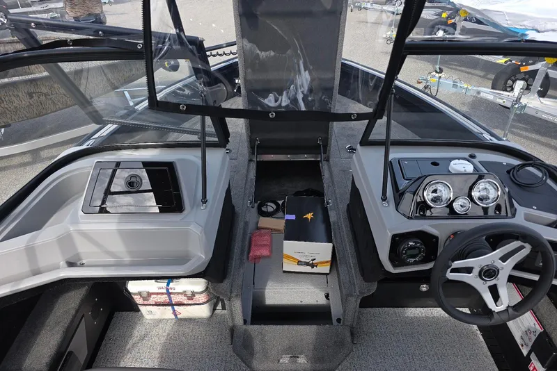 Slide: The Image of Interior view of 2026 Smoker Craft Explorer 190 FS boat cockpit with steering wheel and dashboard. - 10